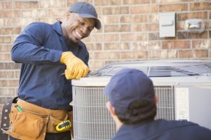 technicians-working-on-an-outdoor-heat-pump-unit